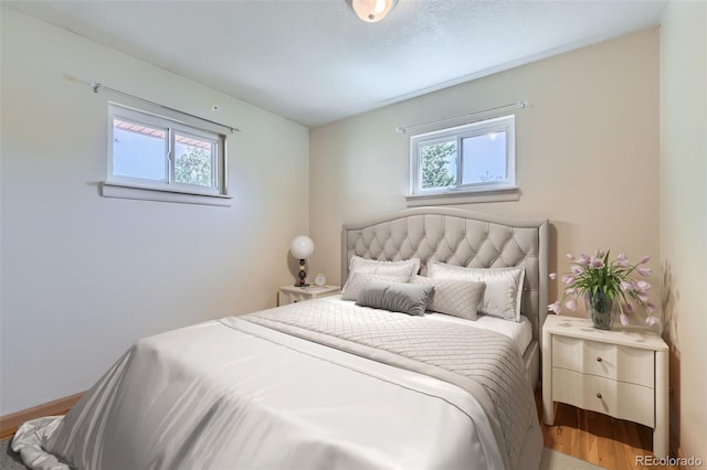 3531 E 91st Ave, Thornton, CO 80229 - bedroom featuring multiple windows, wood finished floors, and baseboards