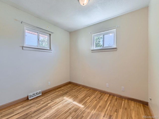 3531 E 91st Ave, Thornton, CO 80229 - spare room with healthy amount of natural light, baseboards, and light wood finished floors