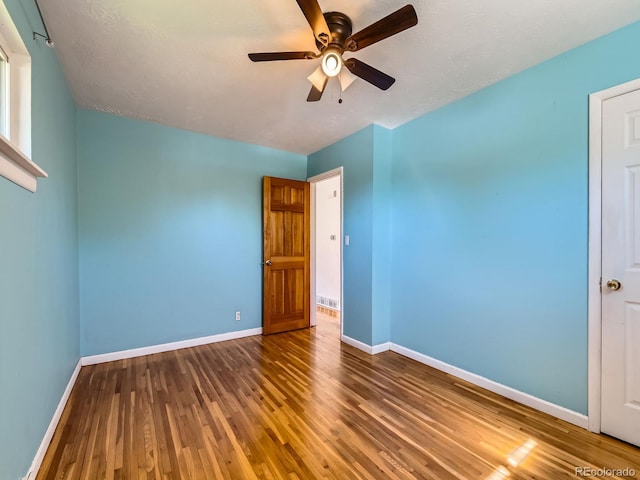 3531 E 91st Ave, Thornton, CO 80229 - unfurnished room featuring wood finished floors, baseboards, and ceiling fan