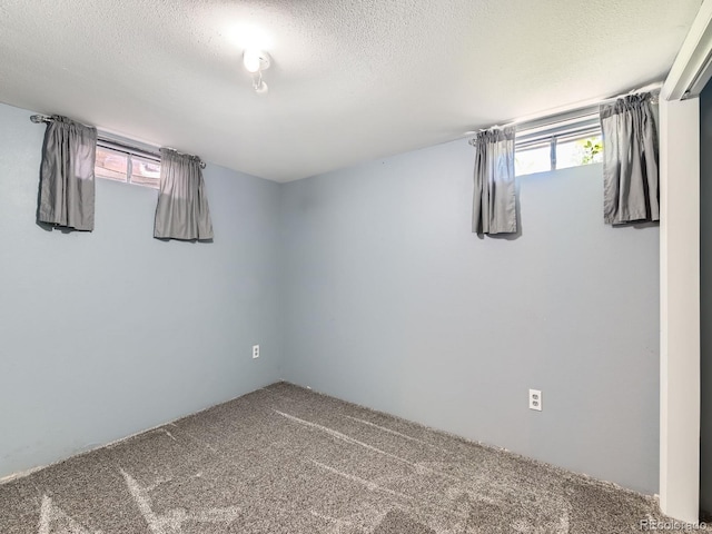 3531 E 91st Ave, Thornton, CO 80229 - basement with carpet floors, plenty of natural light, and a textured ceiling