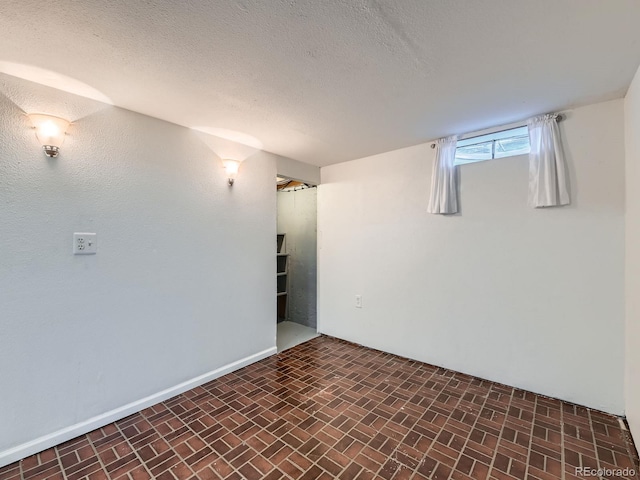 3531 E 91st Ave, Thornton, CO 80229 - basement with brick patterned flooring and a textured ceiling