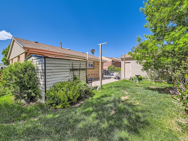 3531 E 91st Ave, Thornton, CO 80229 - view of grassy yard featuring a patio area