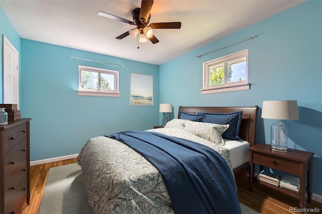 3531 E 91st Ave, Thornton, CO 80229 - bedroom with wood finished floors, baseboards, and a ceiling fan