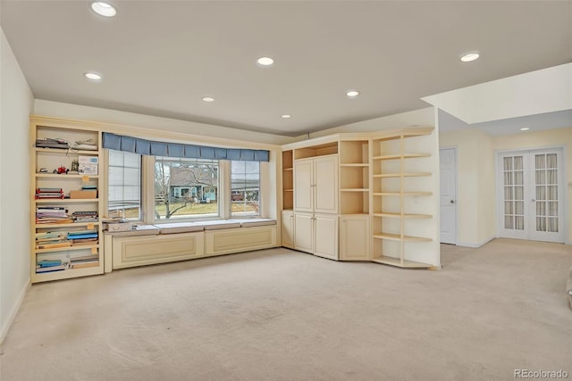 unfurnished bedroom with recessed lighting, french doors, light colored carpet, and baseboards