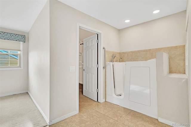 interior space featuring baseboards and recessed lighting