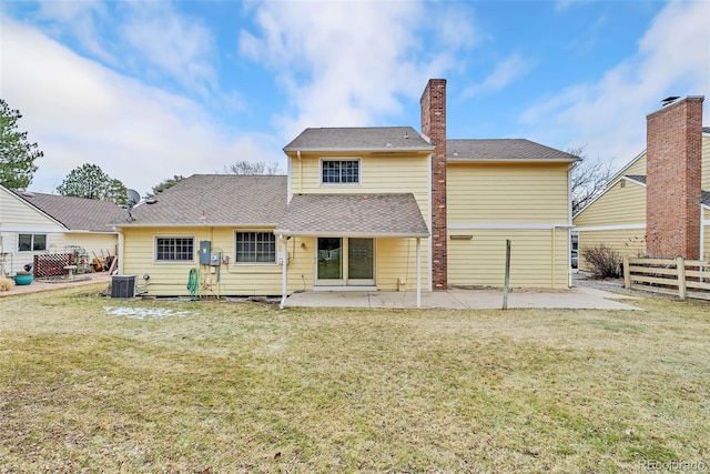 rear view of house with central AC, a lawn, a patio area, and fence