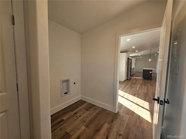 laundry area with dark wood-type flooring and electric dryer hookup