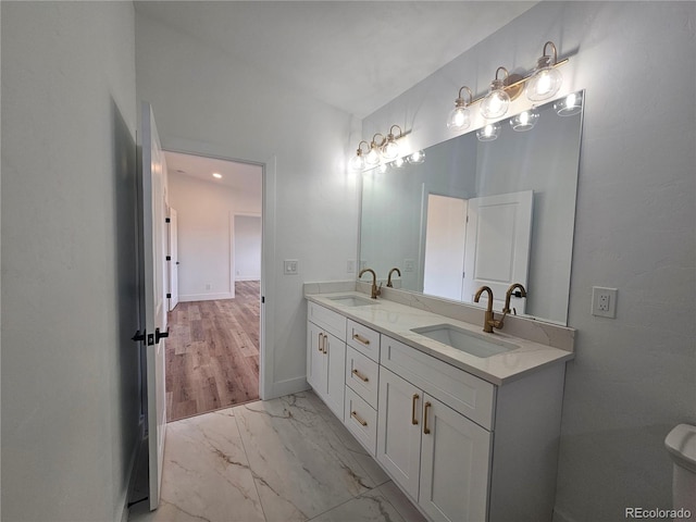 bathroom with vanity and hardwood / wood-style flooring