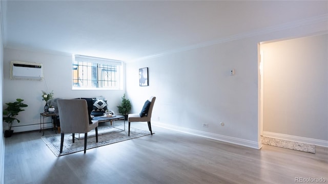 office space with hardwood / wood-style flooring, an AC wall unit, a baseboard heating unit, and ornamental molding