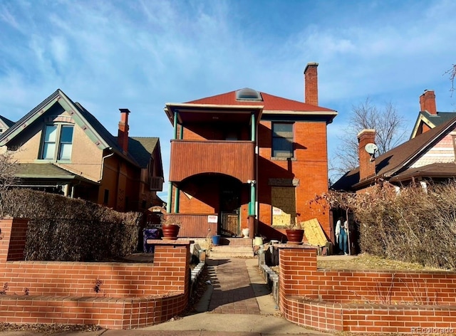 view of front facade with a balcony