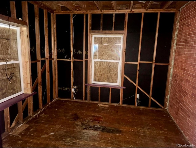 miscellaneous room with brick wall