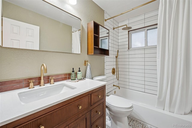 full bathroom featuring vanity, shower / bathtub combination with curtain, and toilet