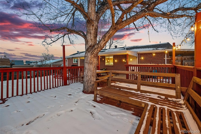 view of snow covered deck