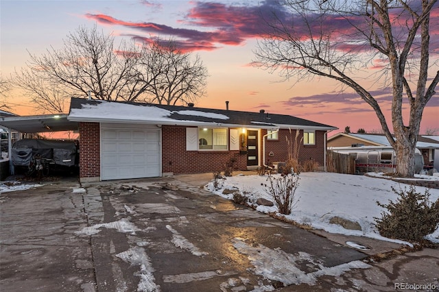 view of front of property featuring a garage and a carport