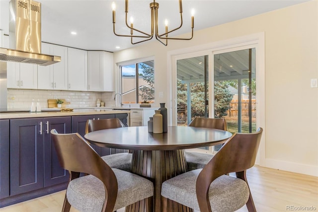 3480 E 119th St, Thornton, CO 80233 - dining space with plenty of natural light, a chandelier, light wood finished floors, and recessed lighting