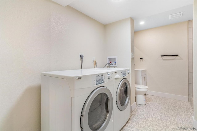 3480 E 119th St, Thornton, CO 80233 - laundry room featuring baseboards and washer and dryer