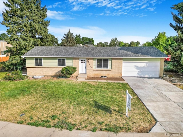 3480 E 119th St, Thornton, CO 80233 - ranch-style house featuring brick siding, concrete driveway, a garage, and a front yard