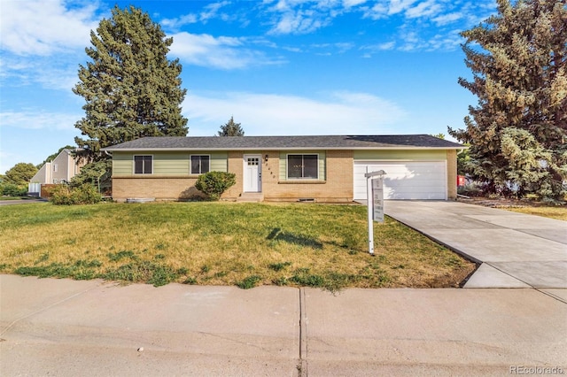 3480 E 119th St, Thornton, CO 80233 - ranch-style house with concrete driveway, a garage, a front yard, and brick siding