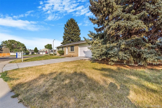 3480 E 119th St, Thornton, CO 80233 - view of front facade featuring driveway, a front lawn, and a garage