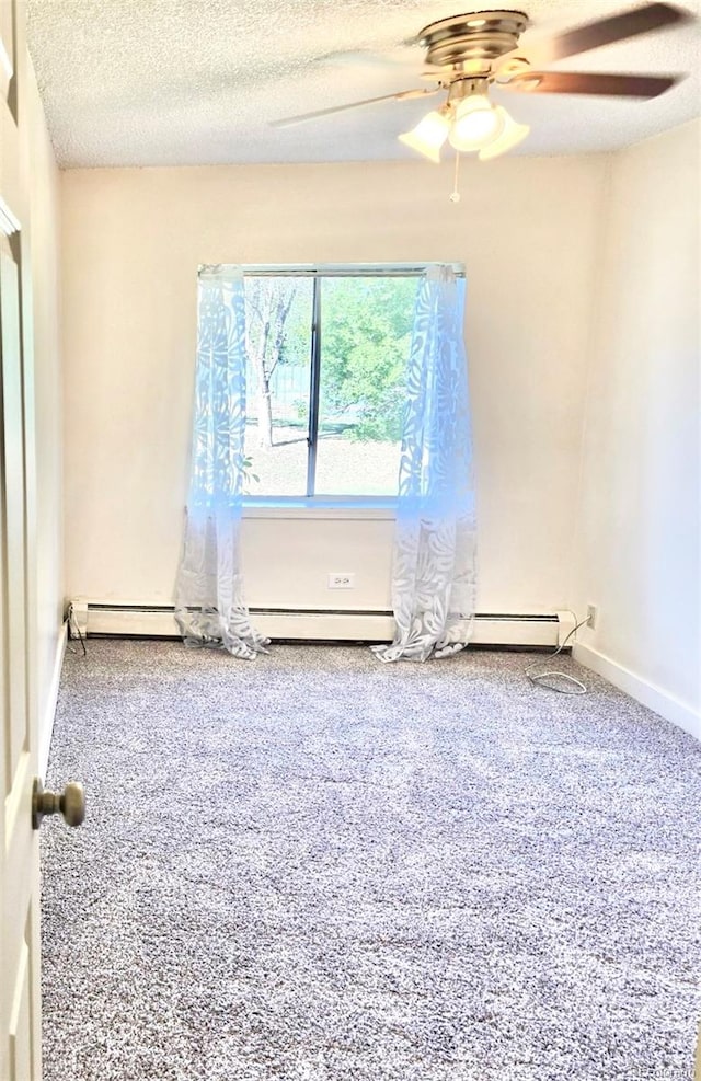 spare room with ceiling fan, carpet floors, and a textured ceiling