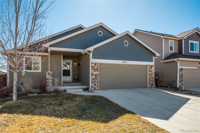 6812 Indian Paintbrush St, Frederick, CO 80530 - craftsman-style house featuring concrete driveway, stone siding, a garage, and a front lawn