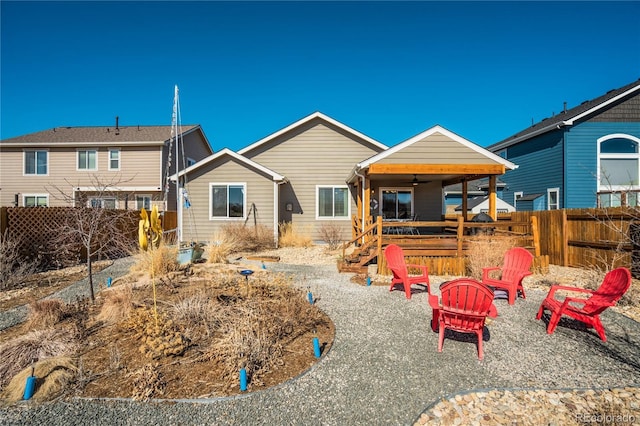 6812 Indian Paintbrush St, Frederick, CO 80530 - back of house featuring a fire pit, a fenced backyard, and ceiling fan