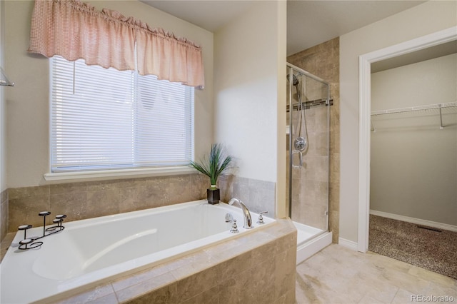 6812 Indian Paintbrush St, Frederick, CO 80530 - full bath with a stall shower, a walk in closet, and plenty of natural light