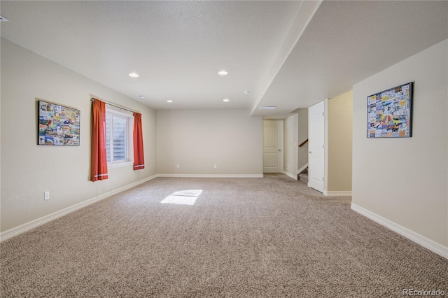6812 Indian Paintbrush St, Frederick, CO 80530 - spare room featuring light carpet, stairway, baseboards, and recessed lighting