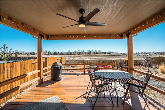 6812 Indian Paintbrush St, Frederick, CO 80530 - deck featuring a ceiling fan and outdoor dining area