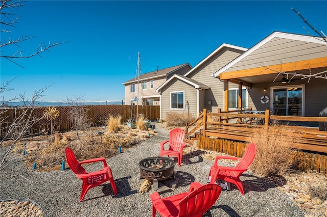 6812 Indian Paintbrush St, Frederick, CO 80530 - view of yard featuring an outdoor fire pit, a wooden deck, and a ceiling fan
