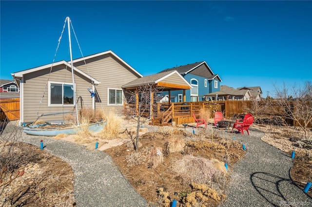 6812 Indian Paintbrush St, Frederick, CO 80530 - rear view of property featuring a fire pit and a gazebo