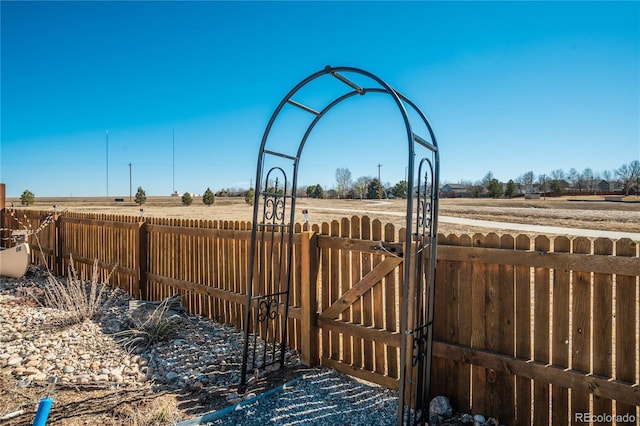 6812 Indian Paintbrush St, Frederick, CO 80530 - view of yard with a gate and a rural view