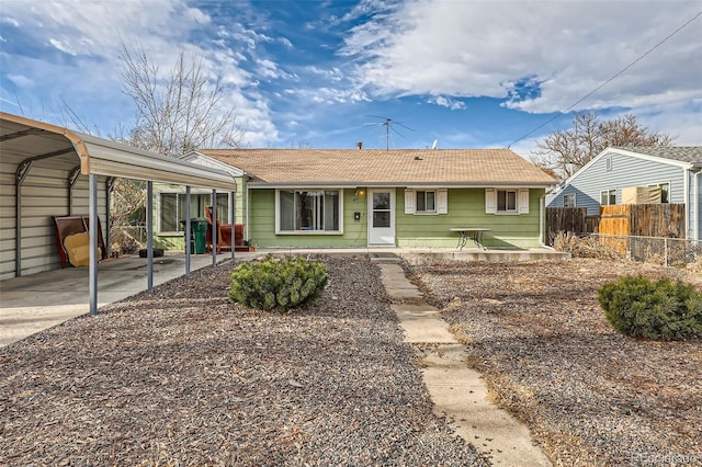 ranch-style home featuring a carport