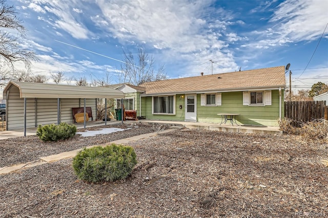 view of front of property with a carport