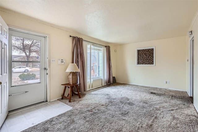 interior space with a wealth of natural light and light colored carpet