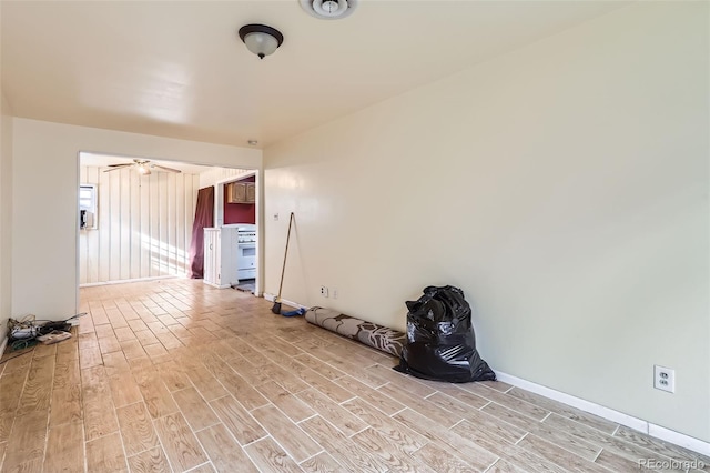 spare room with ceiling fan and light hardwood / wood-style floors