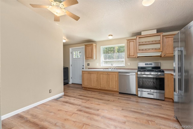 140 Beaver Rd, Idaho Springs, CO 80452 - kitchen with stainless steel appliances, light countertops, light wood-style floors, baseboards, and light brown cabinets