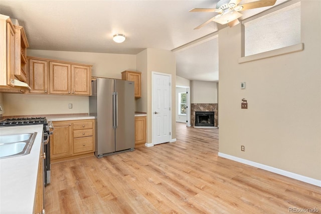 140 Beaver Rd, Idaho Springs, CO 80452 - kitchen with stainless steel appliances, vaulted ceiling, light wood-style floors, a ceiling fan, and light countertops
