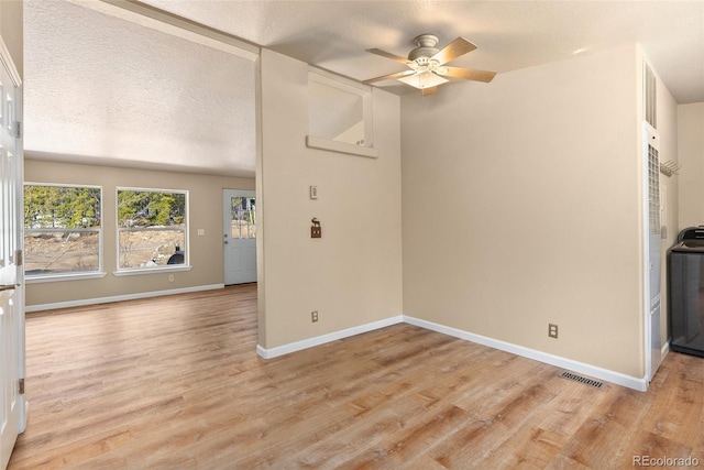 140 Beaver Rd, Idaho Springs, CO 80452 - unfurnished living room featuring light wood-style floors, a ceiling fan, baseboards, and a textured ceiling
