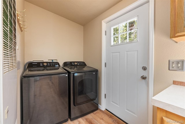 140 Beaver Rd, Idaho Springs, CO 80452 - laundry room featuring separate washer and dryer, light wood finished floors, a heating unit, and baseboards