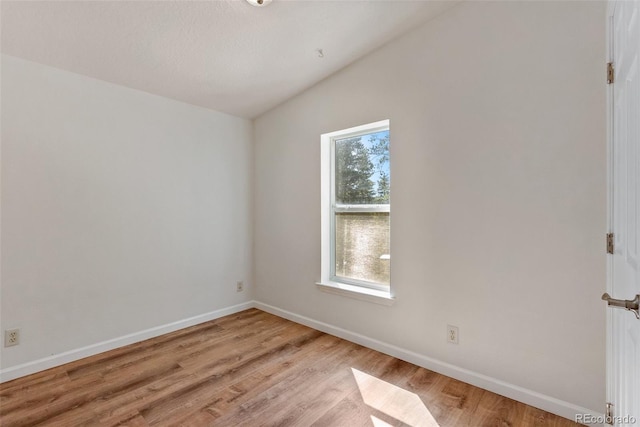 140 Beaver Rd, Idaho Springs, CO 80452 - unfurnished room featuring vaulted ceiling, light wood-type flooring, and baseboards
