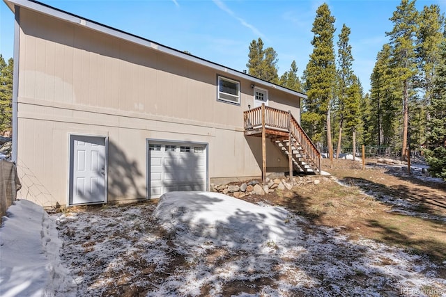140 Beaver Rd, Idaho Springs, CO 80452 - back of house with stairway, a deck, and a garage