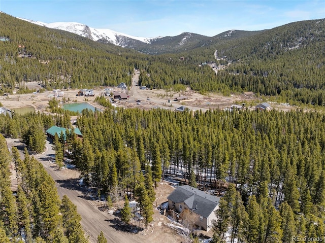 140 Beaver Rd, Idaho Springs, CO 80452 - aerial view of property and surrounding area featuring a forest and mountains