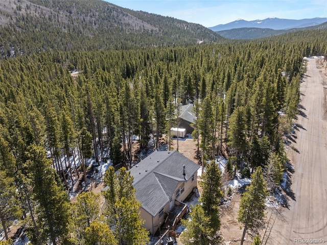 140 Beaver Rd, Idaho Springs, CO 80452 - aerial view of property's location featuring a heavily wooded area and a mountainous background