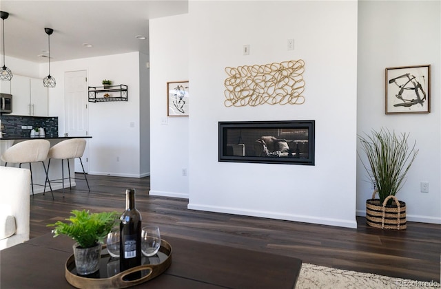 living room with dark wood-type flooring