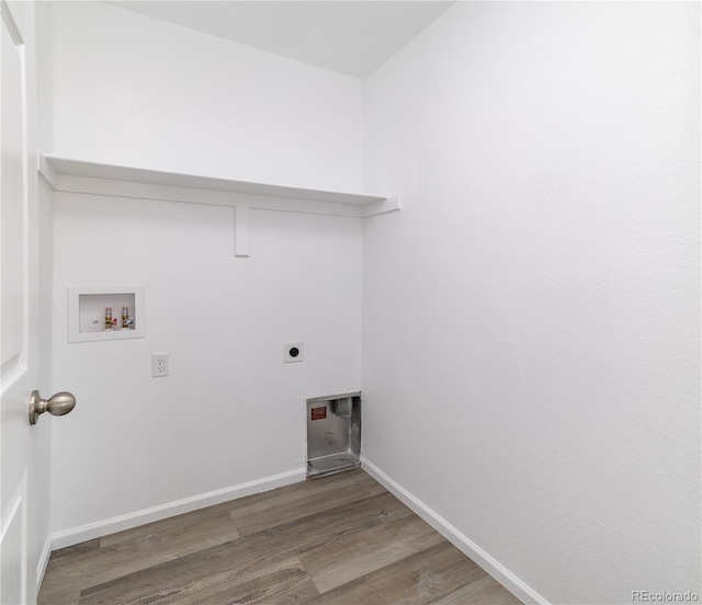 clothes washing area featuring hookup for a washing machine, hardwood / wood-style floors, and electric dryer hookup