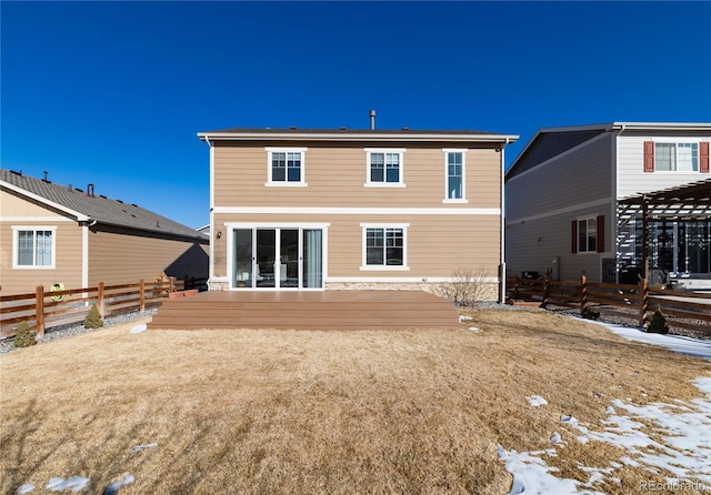 snow covered property featuring a wooden deck and a pergola