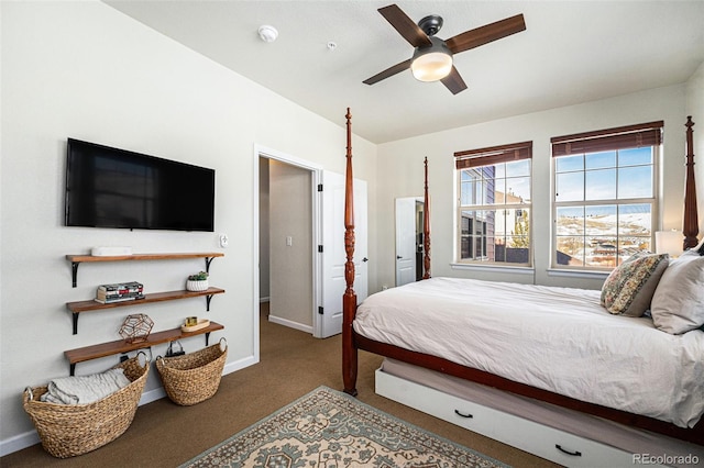 bedroom with ceiling fan, carpet flooring, and baseboards