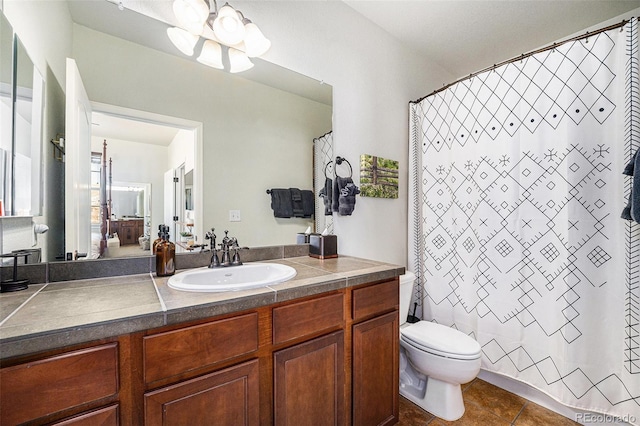 full bath with a chandelier, curtained shower, tile patterned flooring, toilet, and vanity