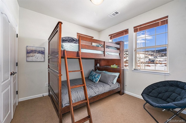 bedroom featuring carpet, visible vents, and baseboards